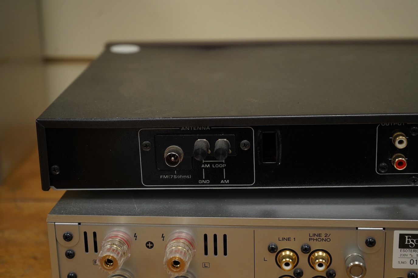 An Esoteric RZ-1 Integrated Music System, amplifier SACD/CD player, together with a Hitachi FT-5500 AM/FM stereo tuner, plus cables.